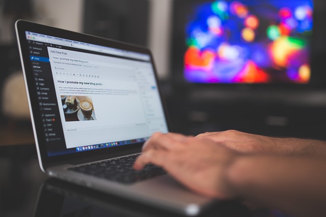 Writing a blog post on laptop, SociShare, Social Media Management