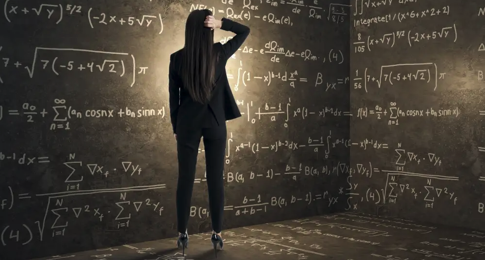 Woman solving equations on chalkboard wall, SociShare, Social Media Management