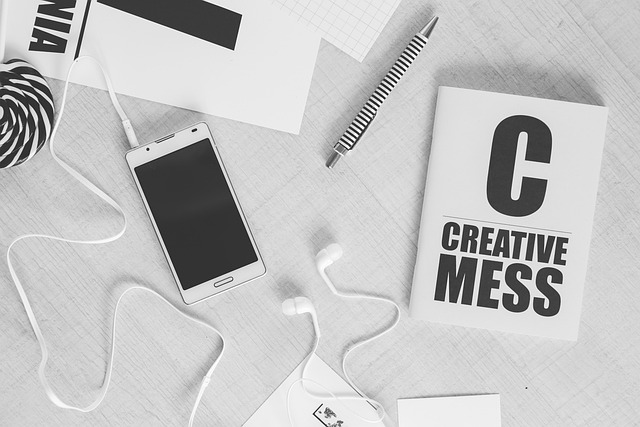 Creative workspace with smartphone and notebook, SociShare, Social Media Management