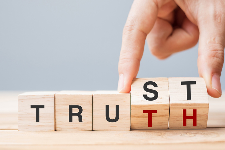 Building trust with wooden blocks concept, SociShare, Social Media Management