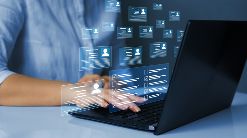 Person managing digital profiles on laptop, SociShare, Social Media Management