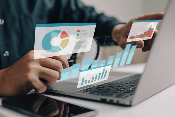 Analyzing digital marketing data on laptop, SociShare, Social Media Management