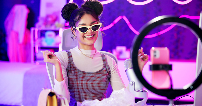 Enthusiastic influencer live-streaming with ring light SociShare Social Media Management